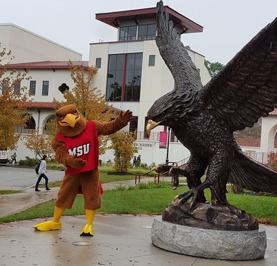 Rocky the Red Hawk shows off his bronze brother outside of College Hall and Panzer Athletic Center. Photo courtesy of Sara Leung