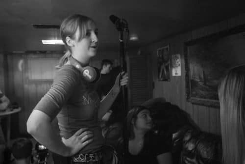 Amanda Adams holding a mic on a film set in 2015. Photo courtesy of Photo courtesy of Chantel Erin.