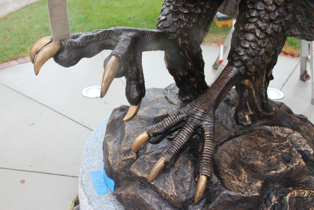 A close=up detail of the statues talons during installation. Photo Credit: Natalie Caamano