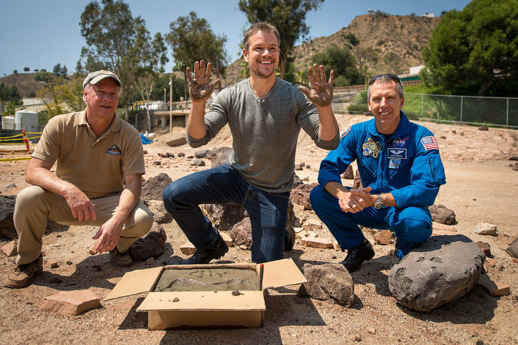 Matt Damon poses behind the scenes of The Martian at the Jet Propulsion Laboratory.