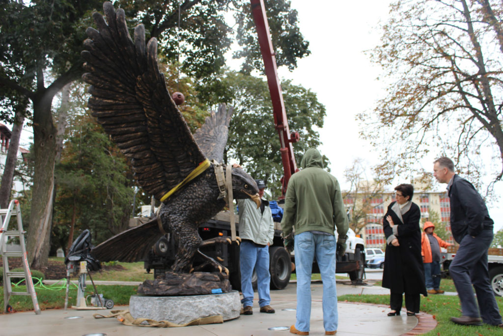 President Susan Cole looks over the installation of the statue on Friday morning. Photo Credit: Natalie Caamano.