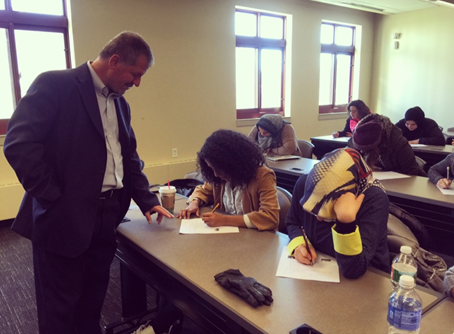 Sehwail administers an exam to students of the Arabic language. Photo Credit: Fatima Abdelslam