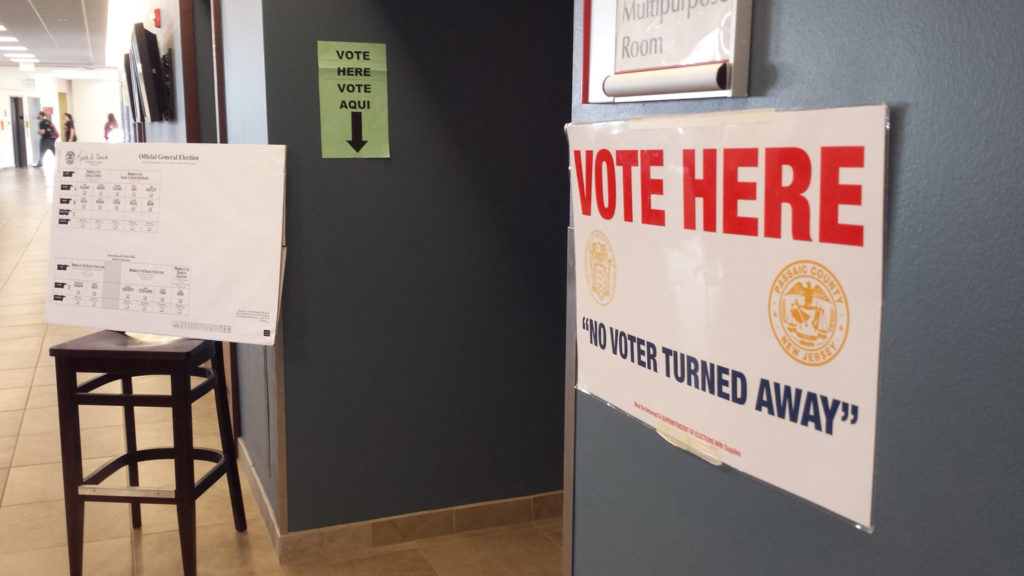 "No Voter Turned Away" read the sign outside of the Machuga Multipurpose Room, where polling stations were set up. Photo Credit: Daniel Falkenheim