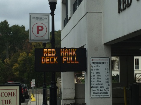 Just one of many signs, familiar to commuters, which indicate that parking lots have become full throughout the day.