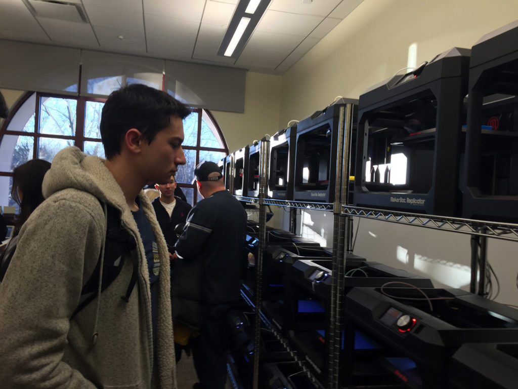 Montclair State student Michael Coviello observed the MIX Lab's 3D printers on the facility's opening day tours. Photo Credit: Jennifer Leon