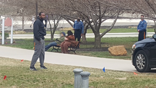 Plain-clothes and uniformed officers kept watch as the victim was taken to a hospital. Photo courtesy of Joe Amditis