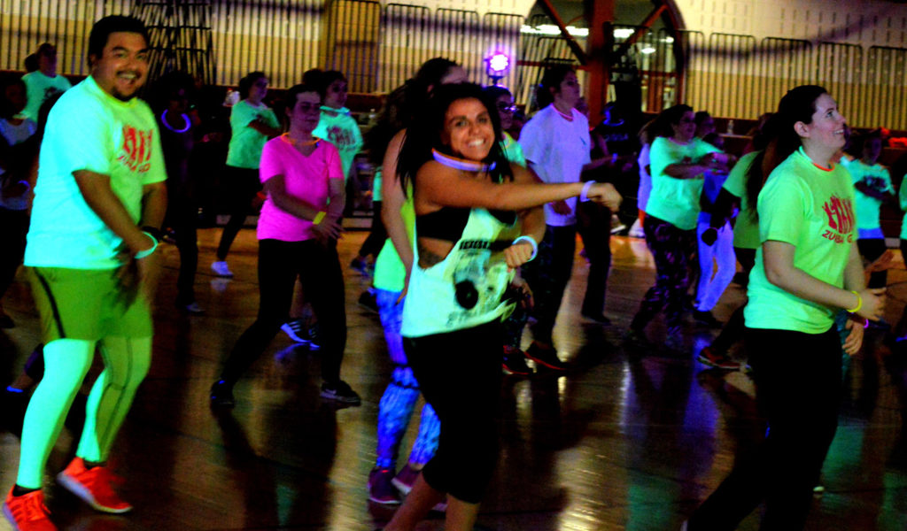 Students came to the Student Recreation Center on Tuesday for the first ever Yoga Glow. Photo Credit: Therese Sheridan