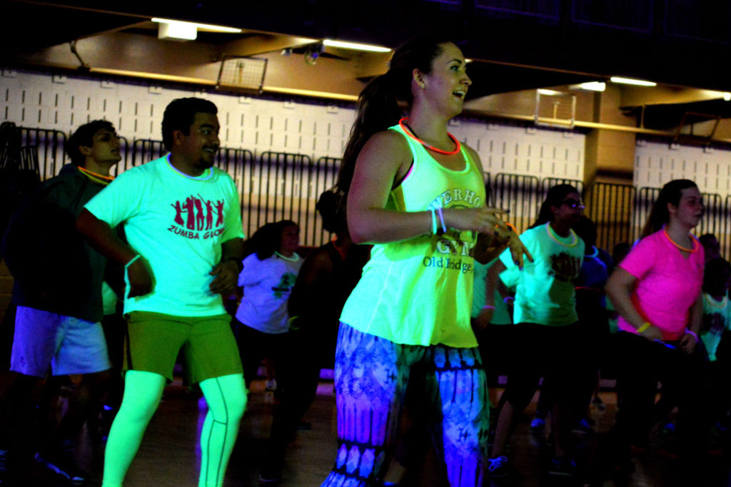 Glow-in-the dark t-shirts were for sale, and participants could take free glow sticks to wear during the workout. Photo Credit: Therese Sheridan