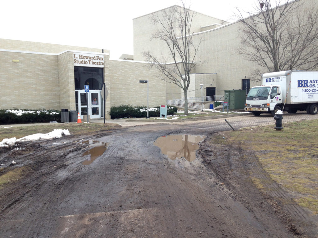 The puddle on Feb. 10, creating a muddy trek for fashion studies and communication students. Photo Credit: Angela Romano