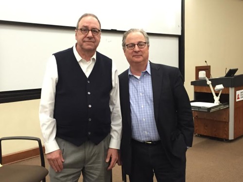 Joe Nocera (Left) and director of the School of Communication and Media Merrill Brown (right) at the colloquium series on March 23. Photo Credit: Sean McChesney