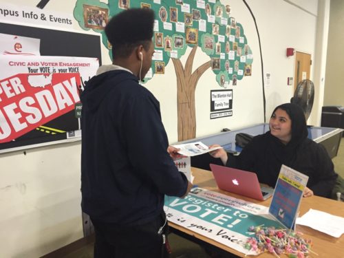 Mahnoor Waseem, Student Assistant for Civic and Voter Engagement and Ambassador of the Andrew Goodman Foundation, informing a student about voter registration. Photo credit: Jennifer Leon