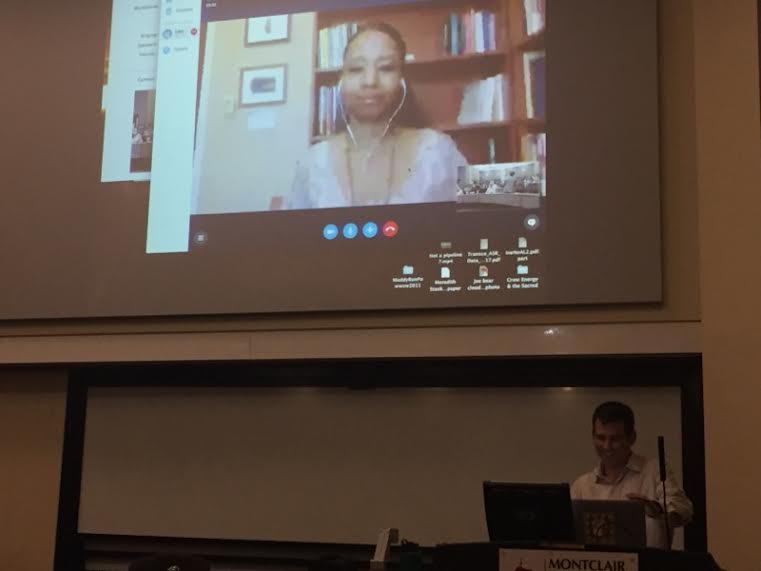Associate Professor of religion Mark Clatterbuck connecting the Skype call with Dr. Larycia Hawkins. Photo Credit: Jennifer Leon