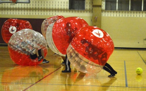 Over 100 students piled into the Rec Center gym for the Bubble Soccer Tournament. Photo Credit: Therese Sheridan