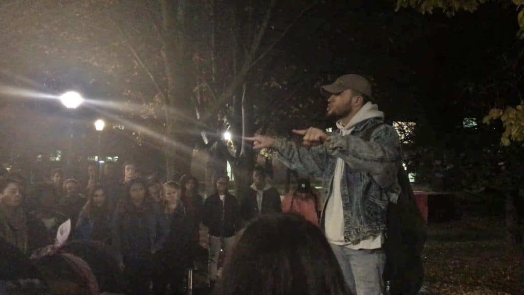 Students address a crowd of about 100 students, fighting injustice and decrying racism and sexism. Photo Credit: Amanda Williams