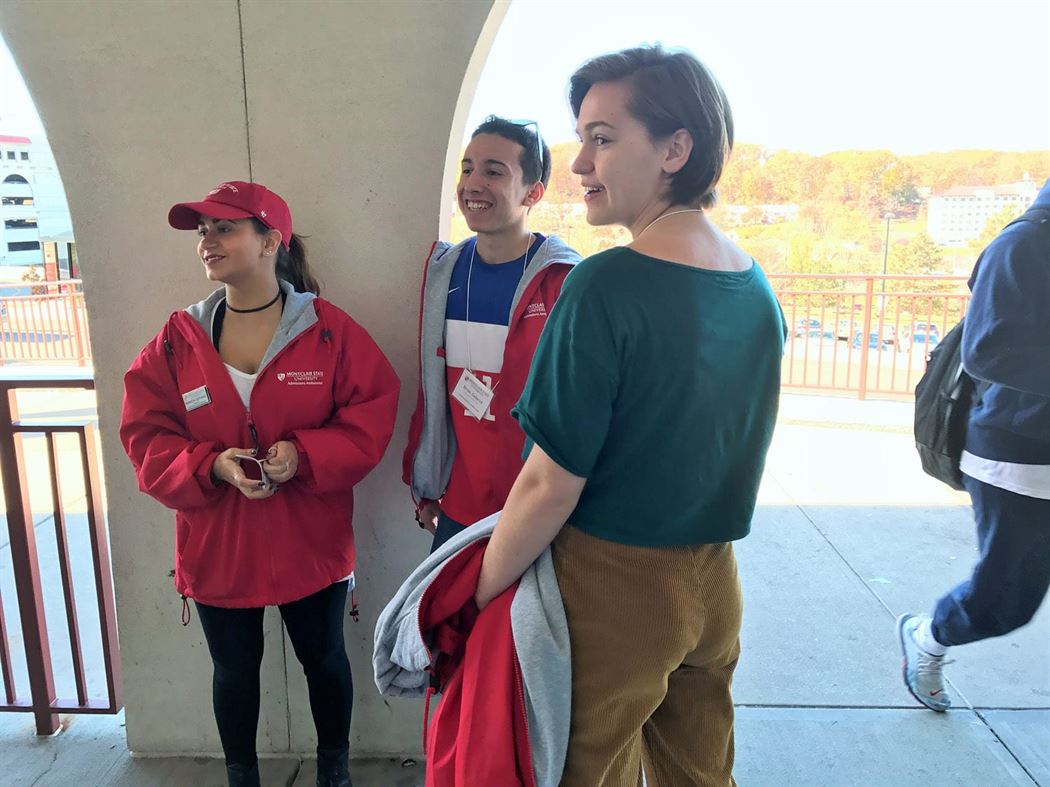 Amanda DePinho (pictured left with cap) says it’s important to give back to students on tours, adding that they give the interested students a chance to find themselves and consider opportunities to get involved on campus. Photo by Daniel Collins