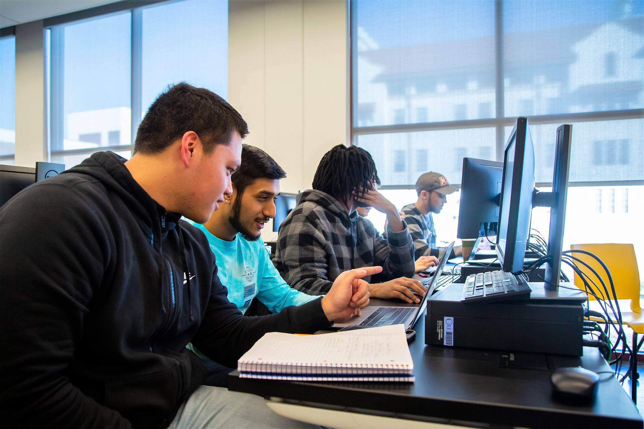 Students work together on an assignment. Chris Krusberg | The Montclarion