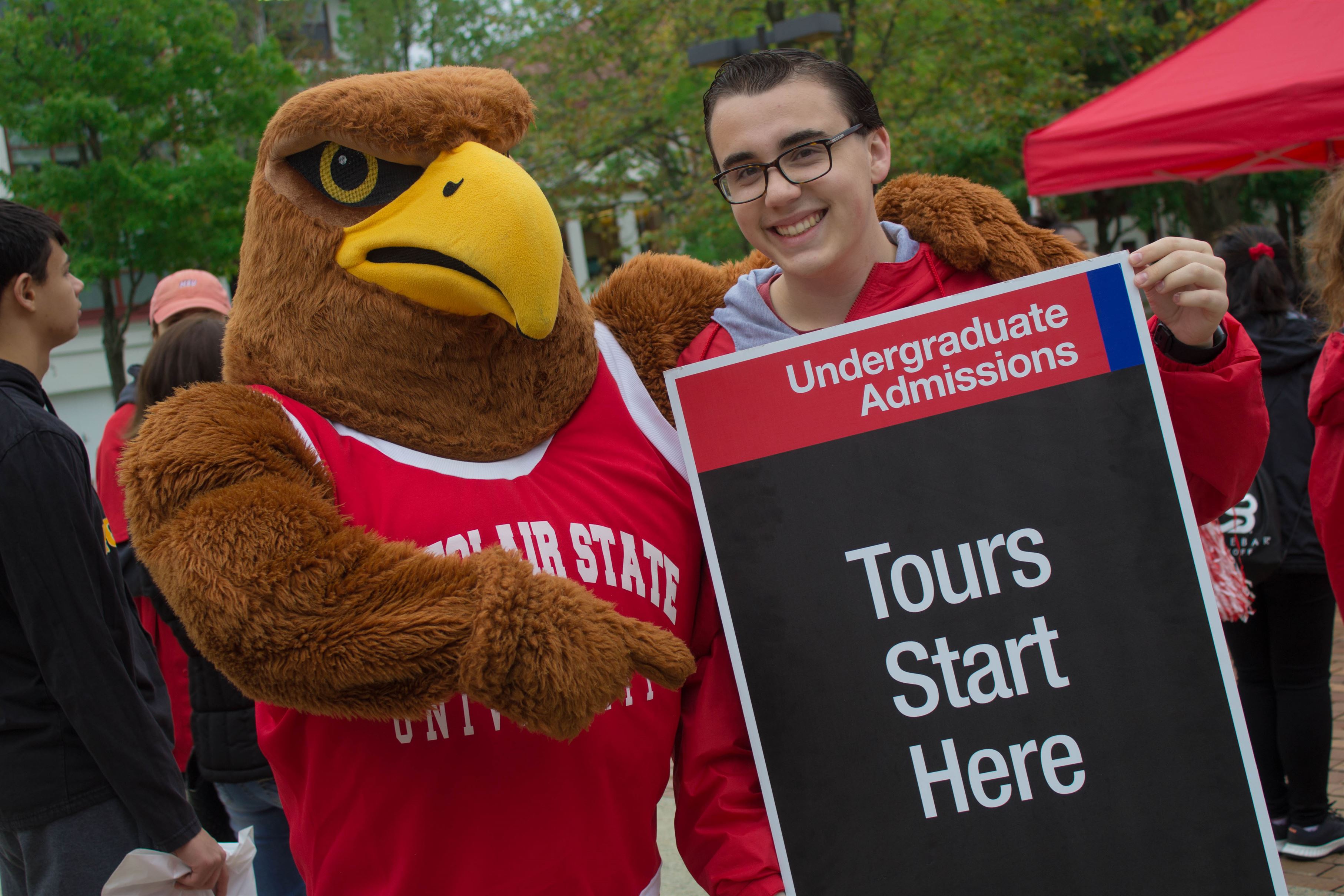Kyle Kennedy posing with Rocky at the Fall 2019 Open house