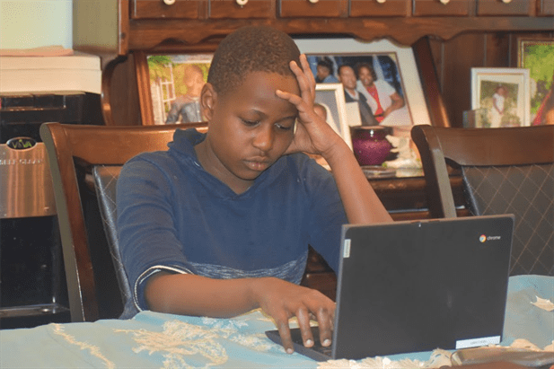 Alex frustrated with his schoolwork. Photo Courtesy of Bernice Ndegwa
