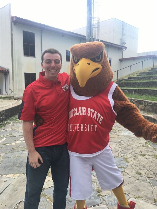 Daniel Waffenfeld poses with Rocky the Red Hawk for a photo. Photo courtesy of Daniel Waffenfeld.