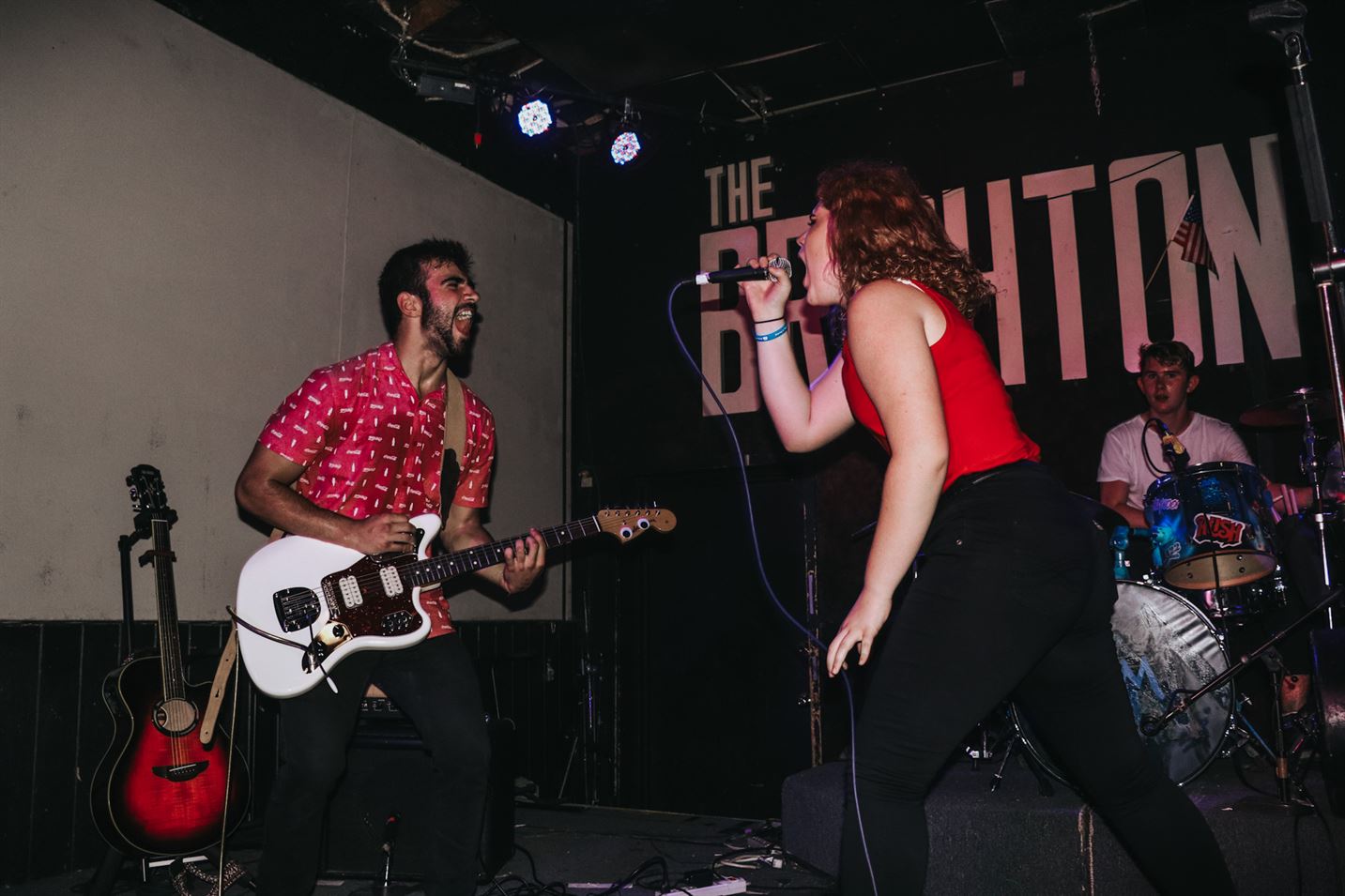 Dan Abbaticchio and Gabrielle Guida screaming and singing to each other at The Brighton Bar in July 2018. Photo Courtesy of Chloe Brenna