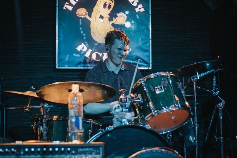 Jack Powers drumming passionately at The Chubby Pickle in November 2019. Photo Courtesy of Tom Grady