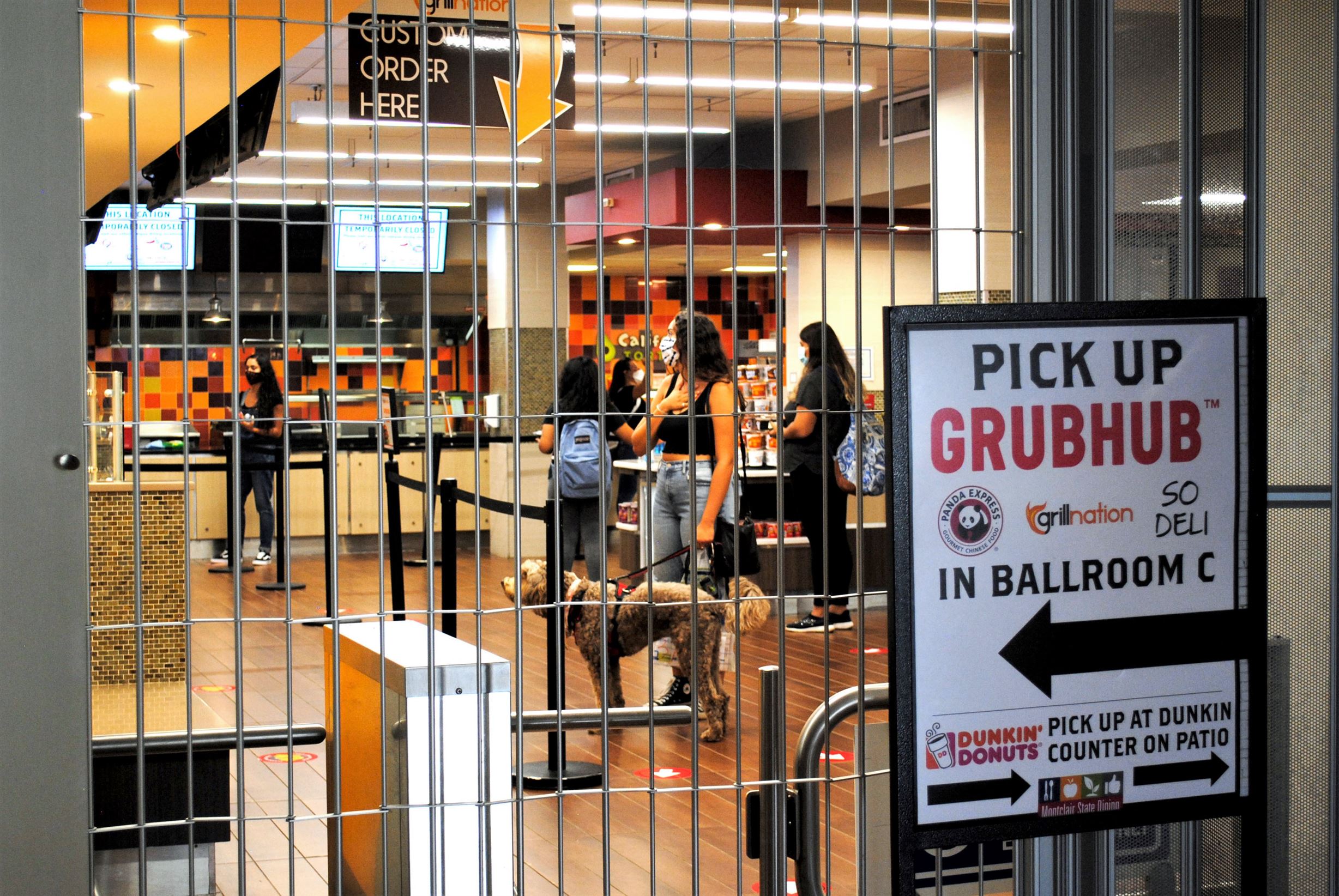 A closed entrance to the student center dining hall directs students to food pick-up locations in order to cut back on crowding. Michael Giannotti | The Montclarion