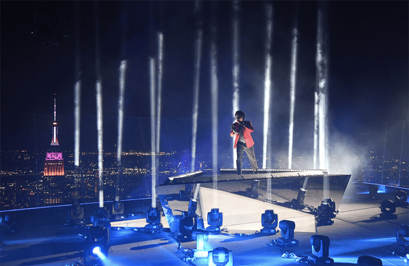 The Weeknd performing "Blinding Lights" above New York City. Photo Courtesy of Billboard.