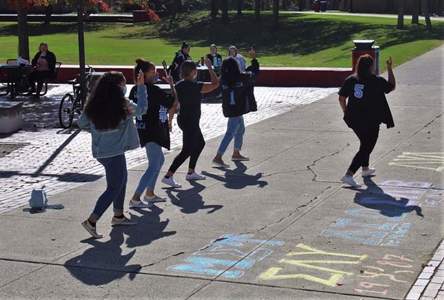 Members of the Mu Sigma Upsilon sorority perform a dance routine in the Student Center quad on University Day. Photo courtesy of Tamar Schwarzer