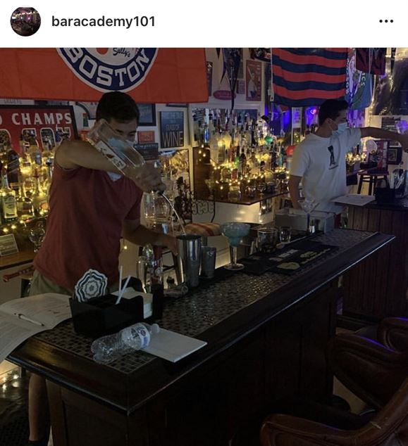 Jack Rizzo (left) and Kevin Doyle (right) practice making different drinks. Photo courtesy of Robert Troisi | @baracademy101