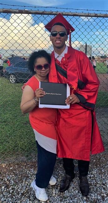 Martin and his mother pose for a photo after graduating from Kingsway High School in 2019. Photo courtesy of Cameryn Martin