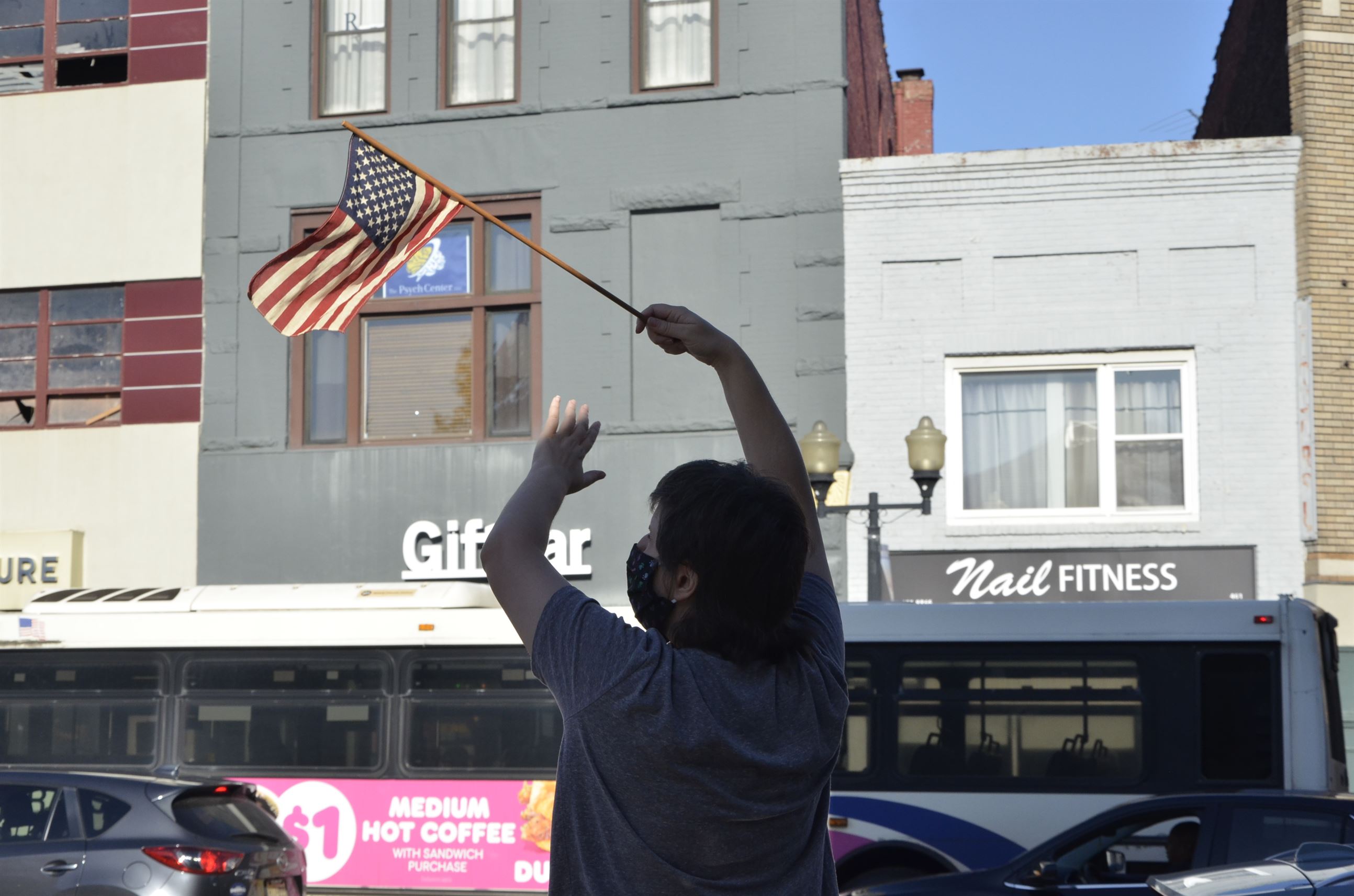 A young boy waves an American flag. John LaRosa | The Montclarion