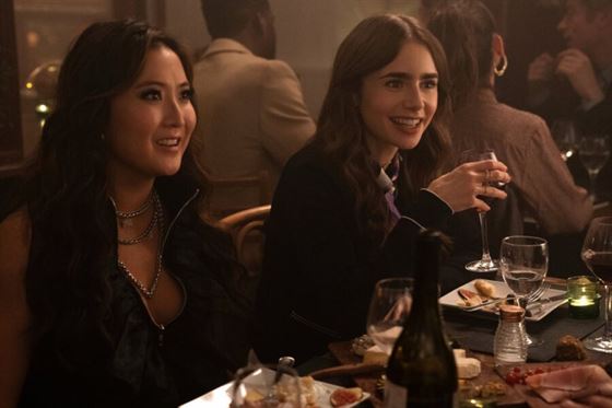 Mindy Chen (Ashley Park) accompanies Emily Cooper (Lily Collins) to dinner. Photo courtesy of Netflix