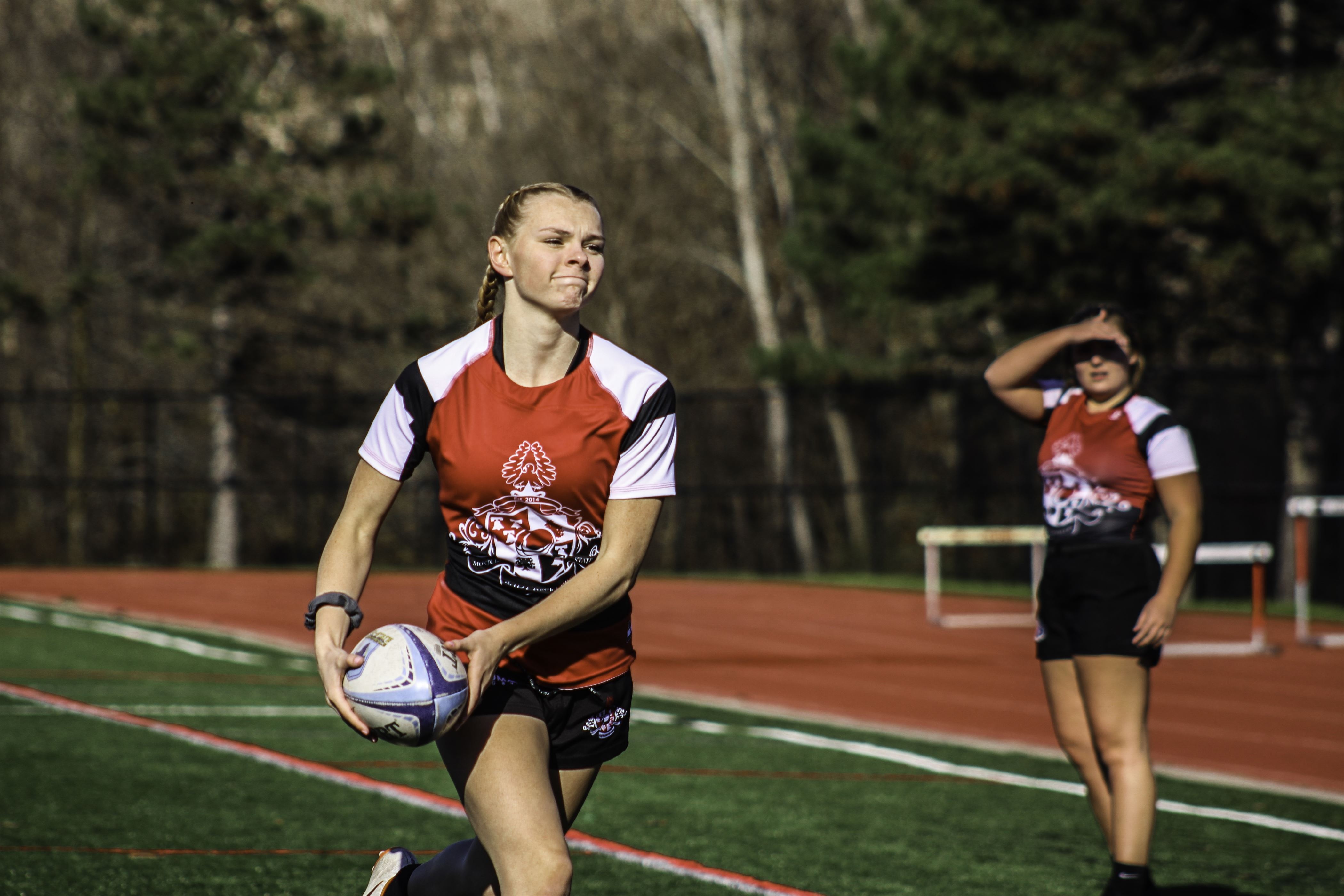 Junior scrumhalf Jadyn Hermanns looks to pass during a warm-up drill before the start of the team's intrasquad scrimmage Corey Annan | The Montclarion