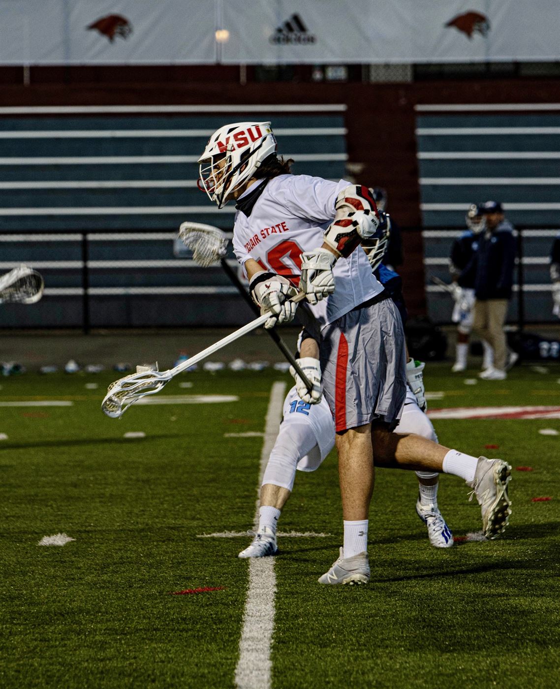 Red Hawks junior attacker Robert Brennan leans forward to take a shot as he scores his first goal of the season. David Venezia | The Montclarion