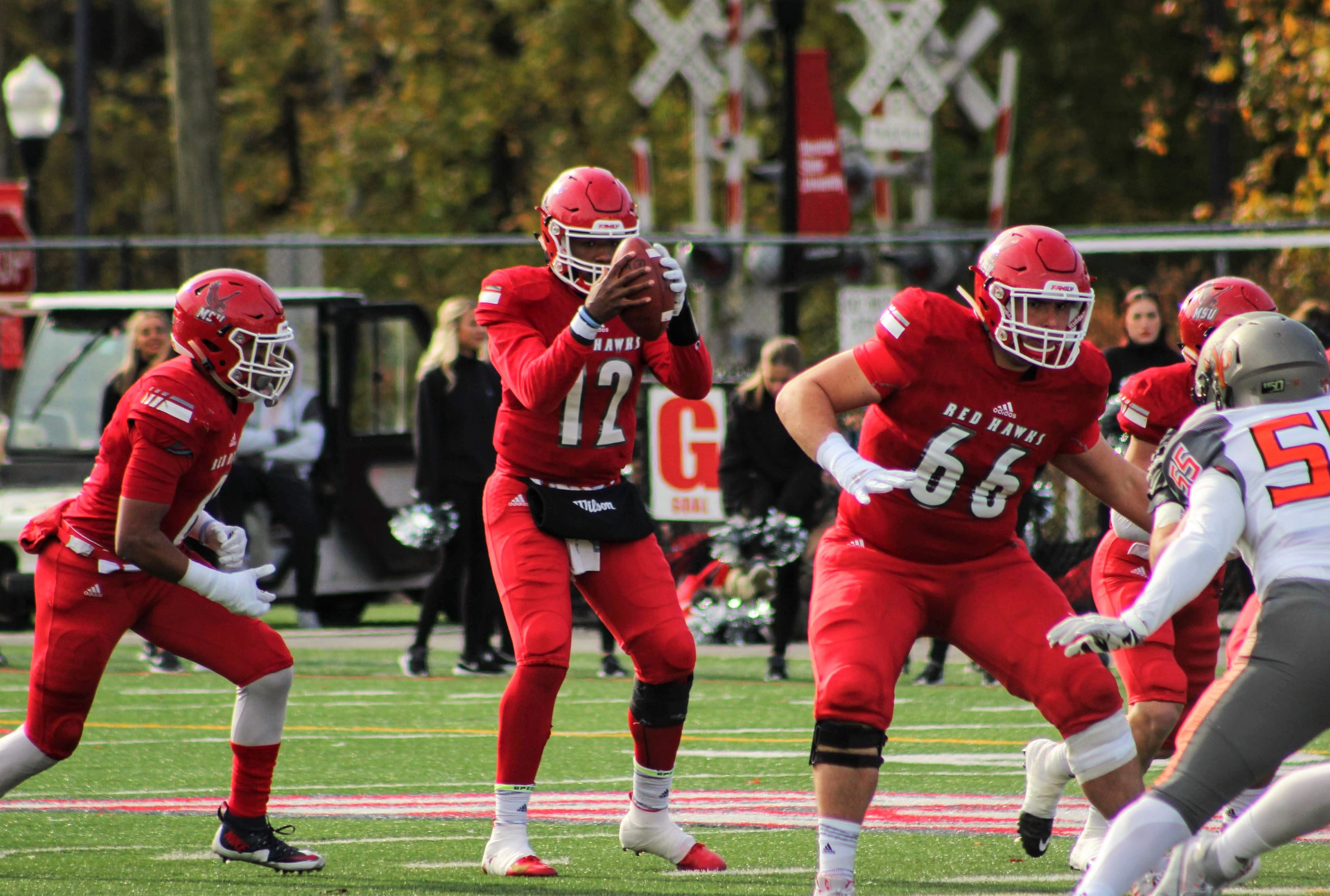 Red Hawks junior quarterback Ja'Quill Burch catches a snap in a 2019 home game against William Paterson University. Ben Caplan | The Montclarion