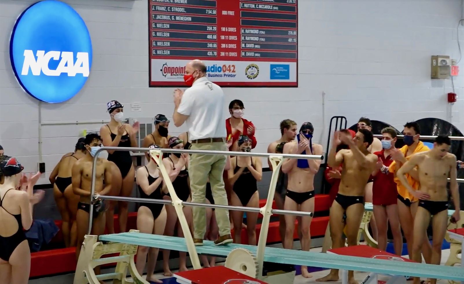 Head coach Brian McLaughlin speaks to the team before the first conference swim meet of the season. Photo courtesy of Kayla Francione
