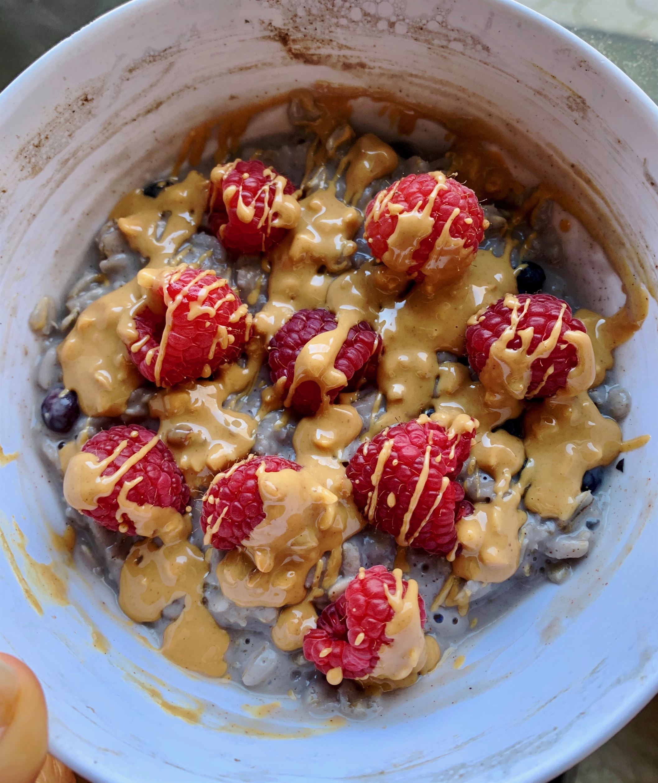 This is an oatmeal bowl the "Gourmet Bailey" way, topped with crunchy peanut butter and fresh raspberries. Samantha Bailey | The Montclarion