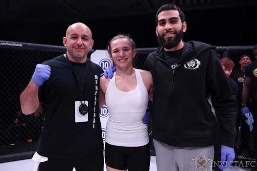 Blanchfield poses with her trainers Augie Matias (left) and Frankie Roberts (right). Photo courtesy of Erin Blanchfield