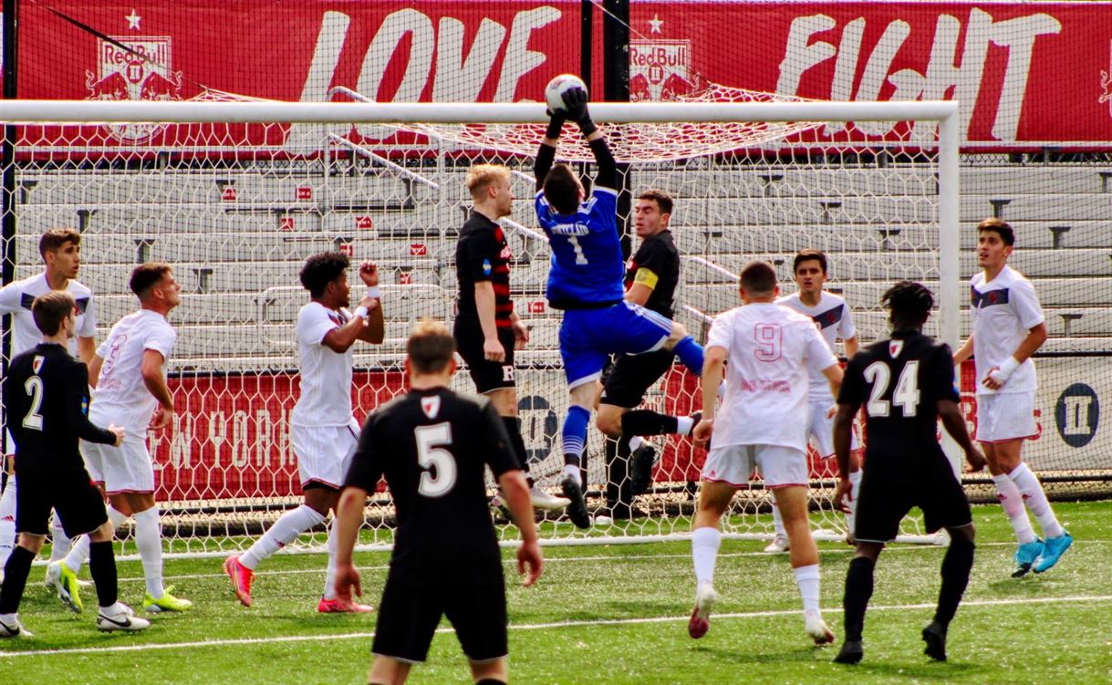 Red Hawks junior goalkeeper Shane Keenan jumps above everyone to catch the ball. Trevor Giesberg | The Montclarion