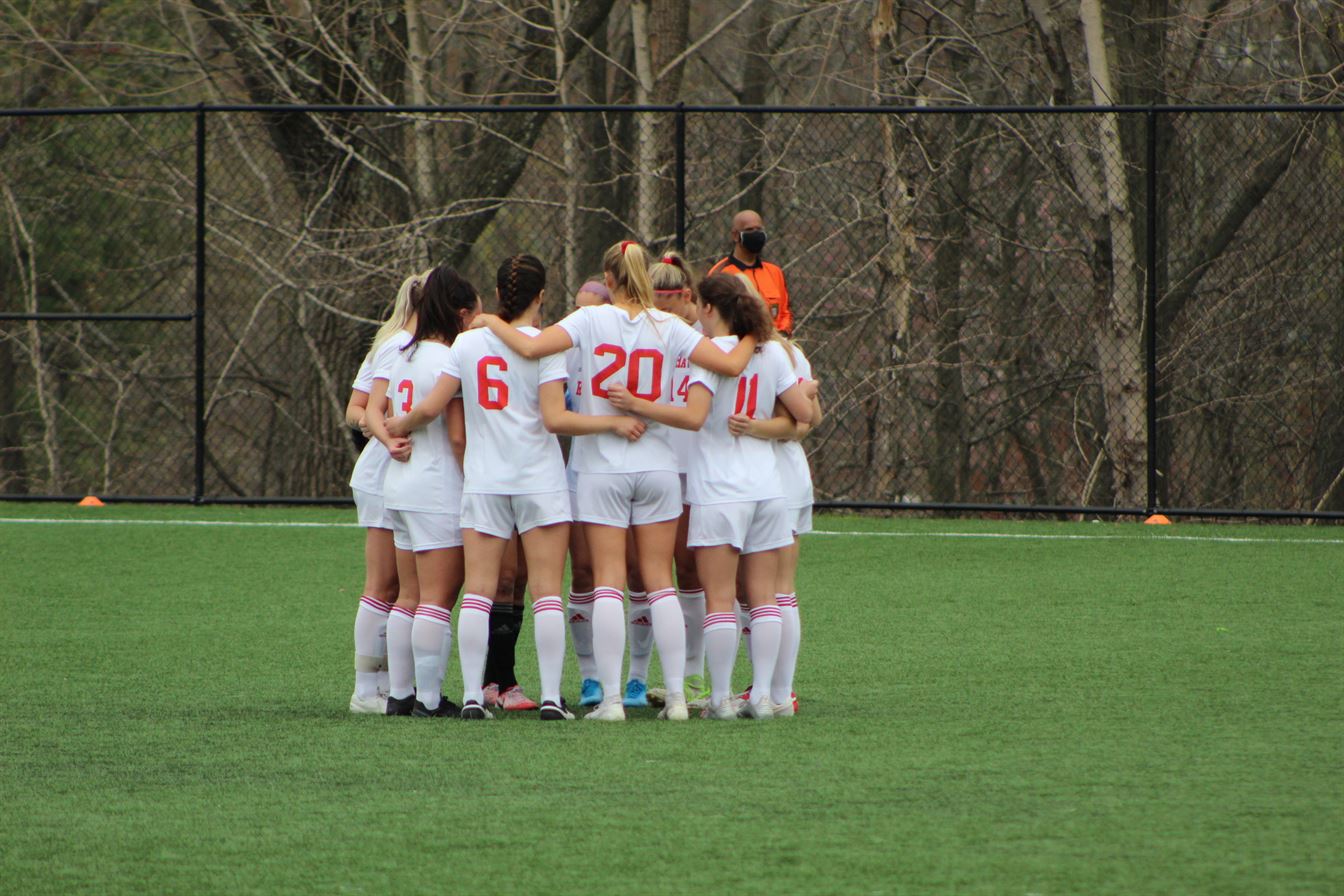 The Red Hawks huddle up during their NJAC Semifinal game against Stockton on April 10. Trevor Giesberg | The Montclarion