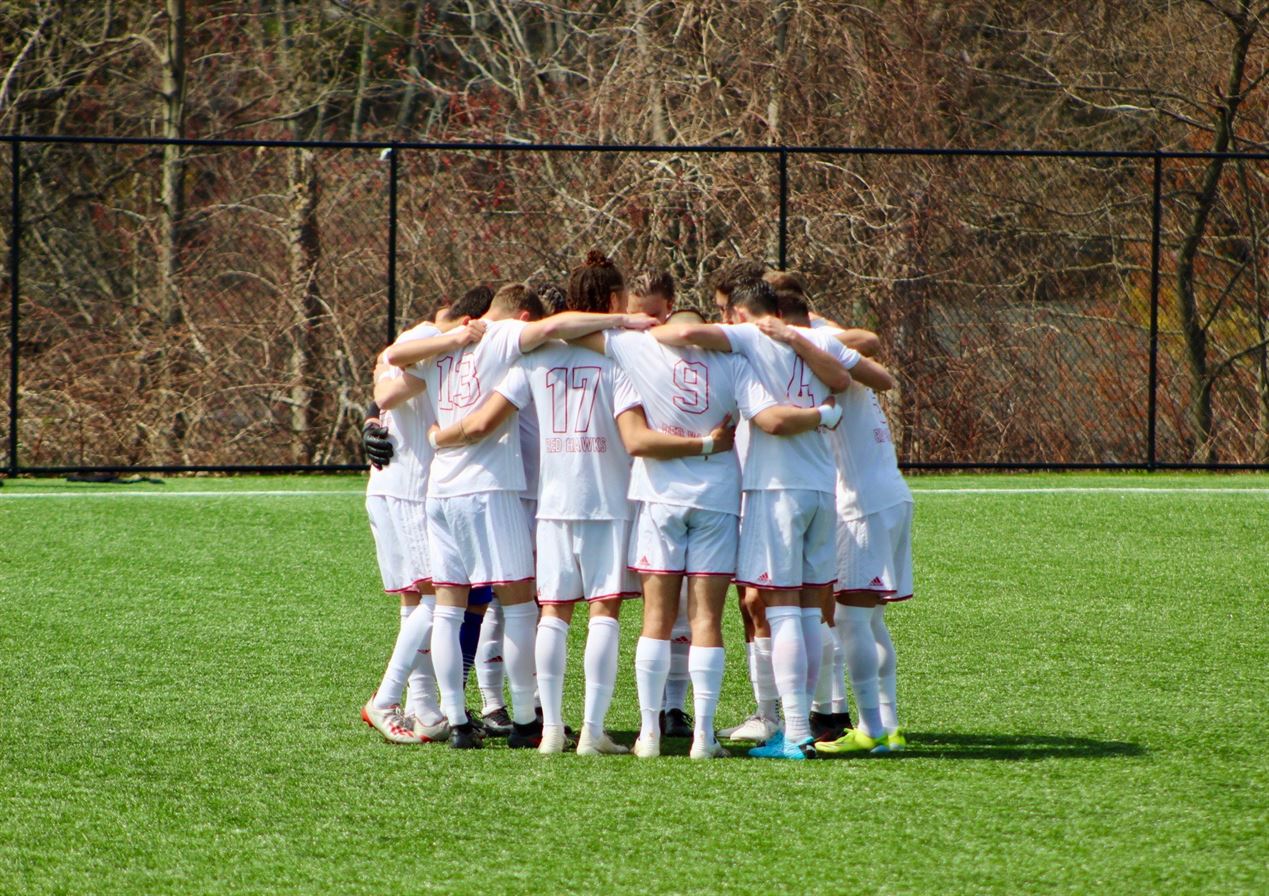 The Red Hawks huddle up before the game. Trevor Giesberg | The Montclarion