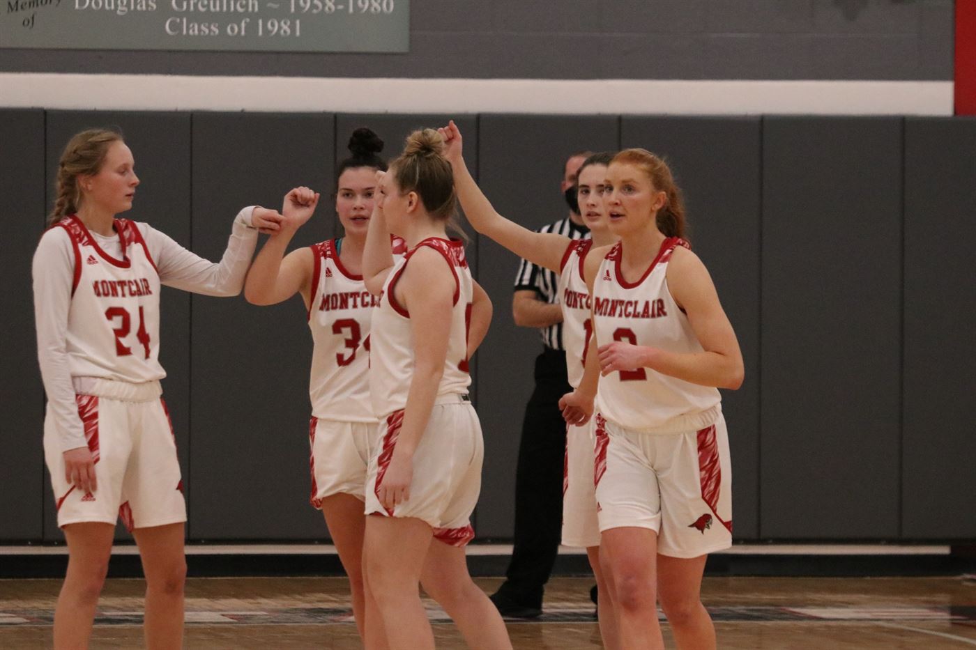 The Montclair State women's basketball team players come together to celebrate a play during the NJAC quarterfinals against Rutgers-Camden on March 5. Photo courtesy of Julia Radley