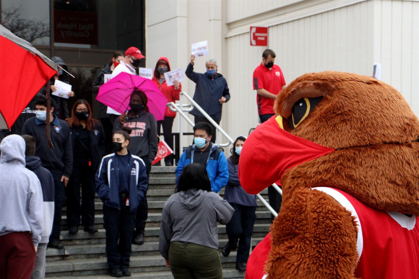 Rocky the Redhawk overlooking students and facility getting ready for a picture. John LaRosa | The Montclarion