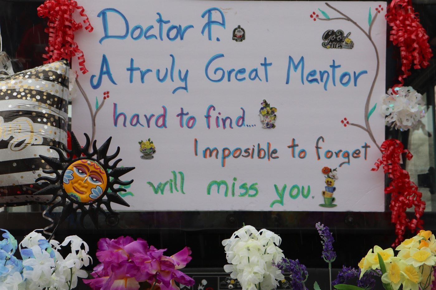 A note decorated in flowers to Dr. Pennington that trailed behind one of the golf karts. John LaRosa | The Montclarion