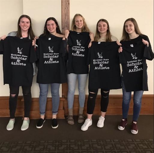 Smith and some of her teammates, including Julia Sutton, receiving an honor for being great athletes and great students as well. Photo courtesy of Kelly Smith