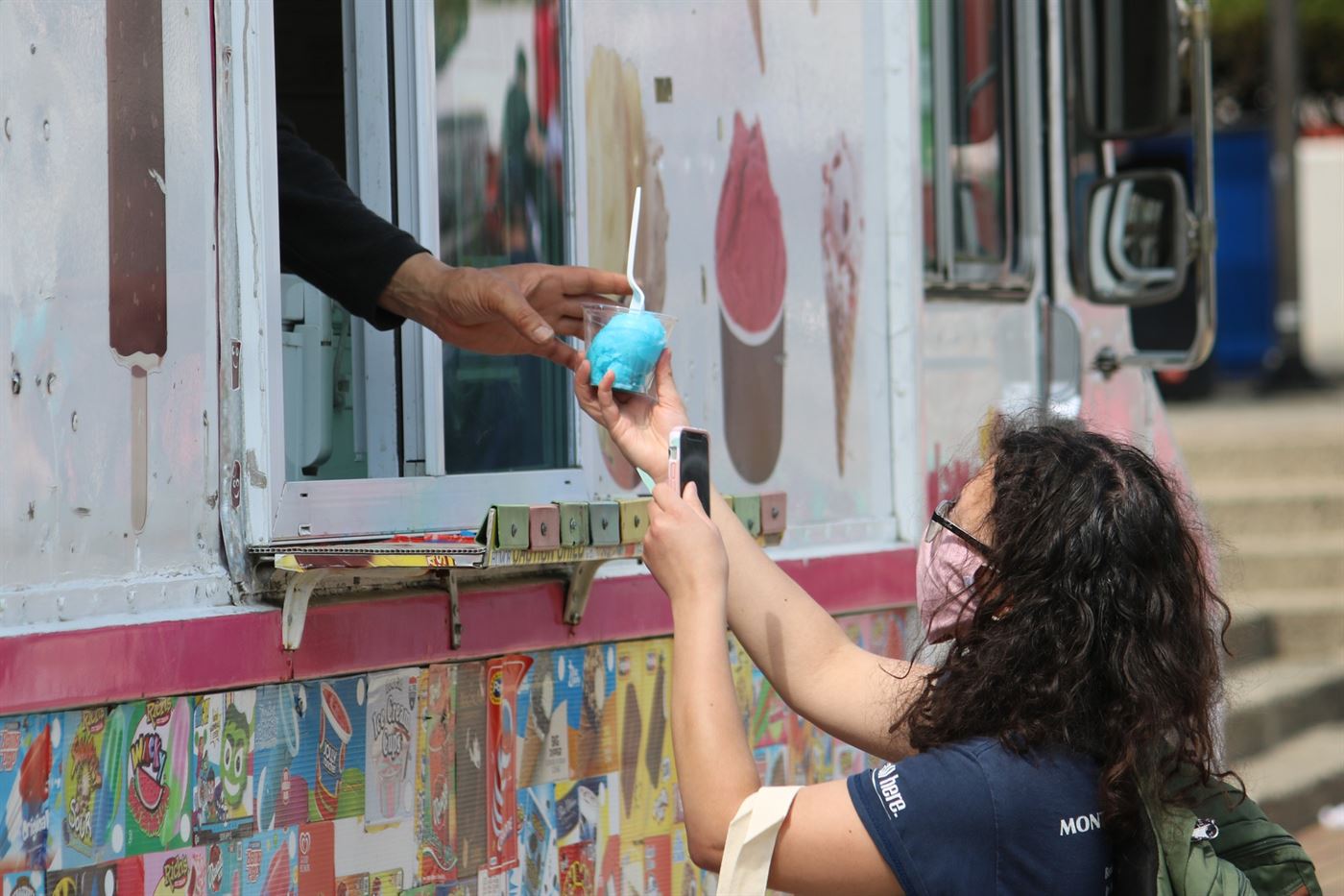 A student receives water ice at the Earth Day Week Extravaganza at the Quad. Kyra Maffia | The Montclarion