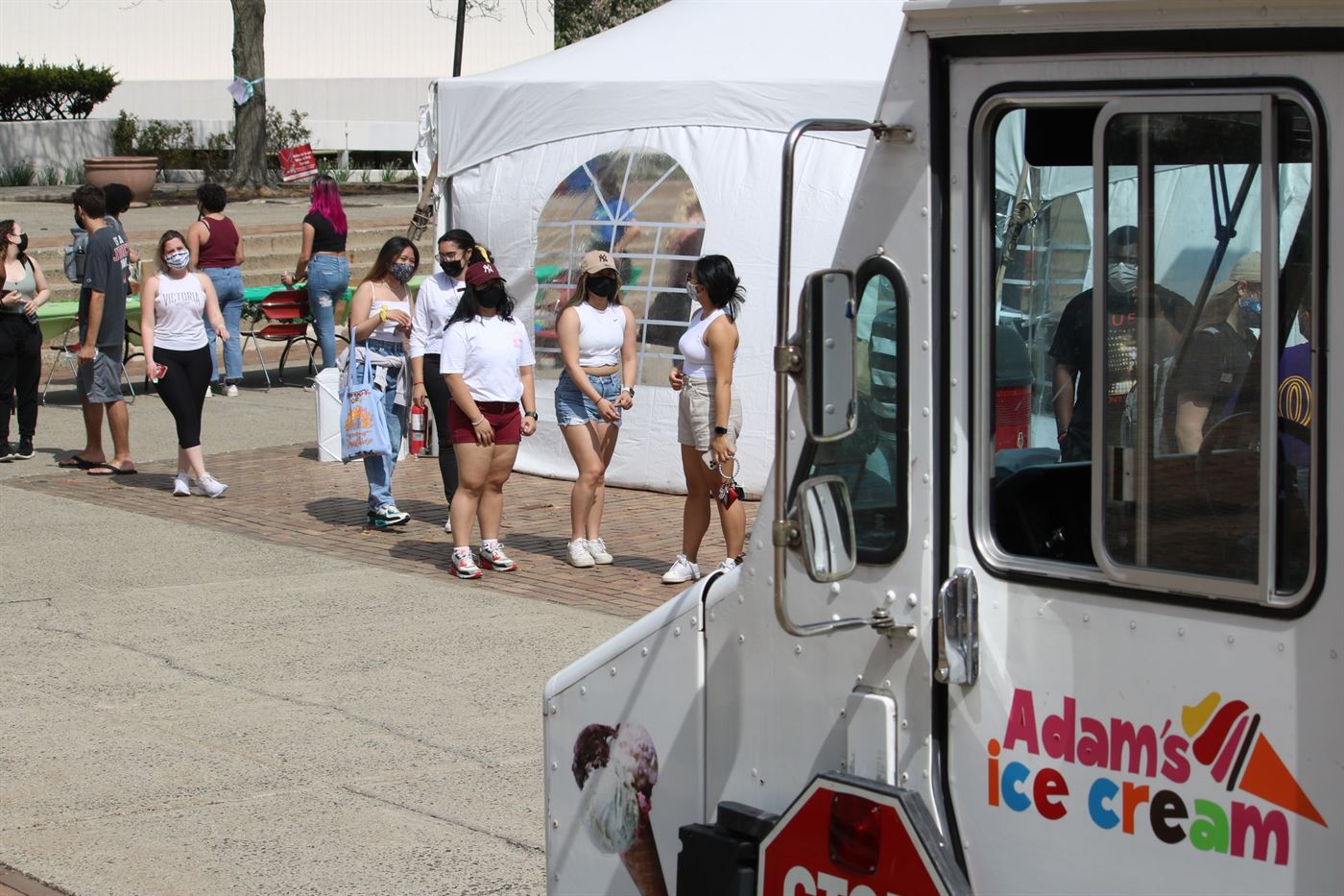 Students line up for the ice cream truck at the Earth Day Week Extravanganza at the Quad. Kyra Maffia | The Montclarion