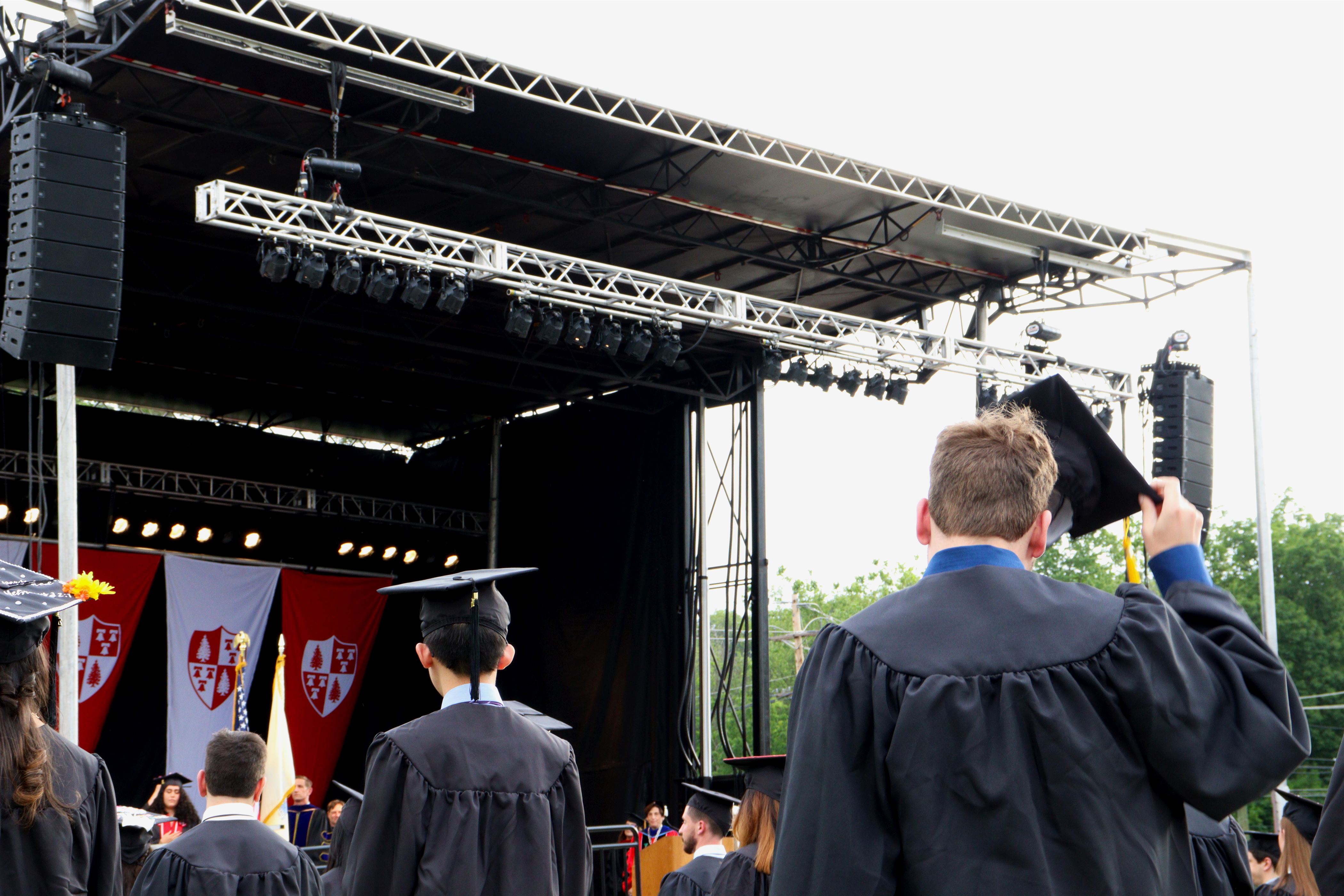 A student removes their cap during the opening ceremony. John LaRosa | The Montclarion