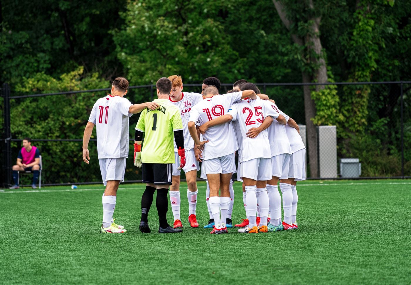 Players of the Montclair State men's soccer team huddle up prior to the start of the game. Photo courtesy of David Venezia