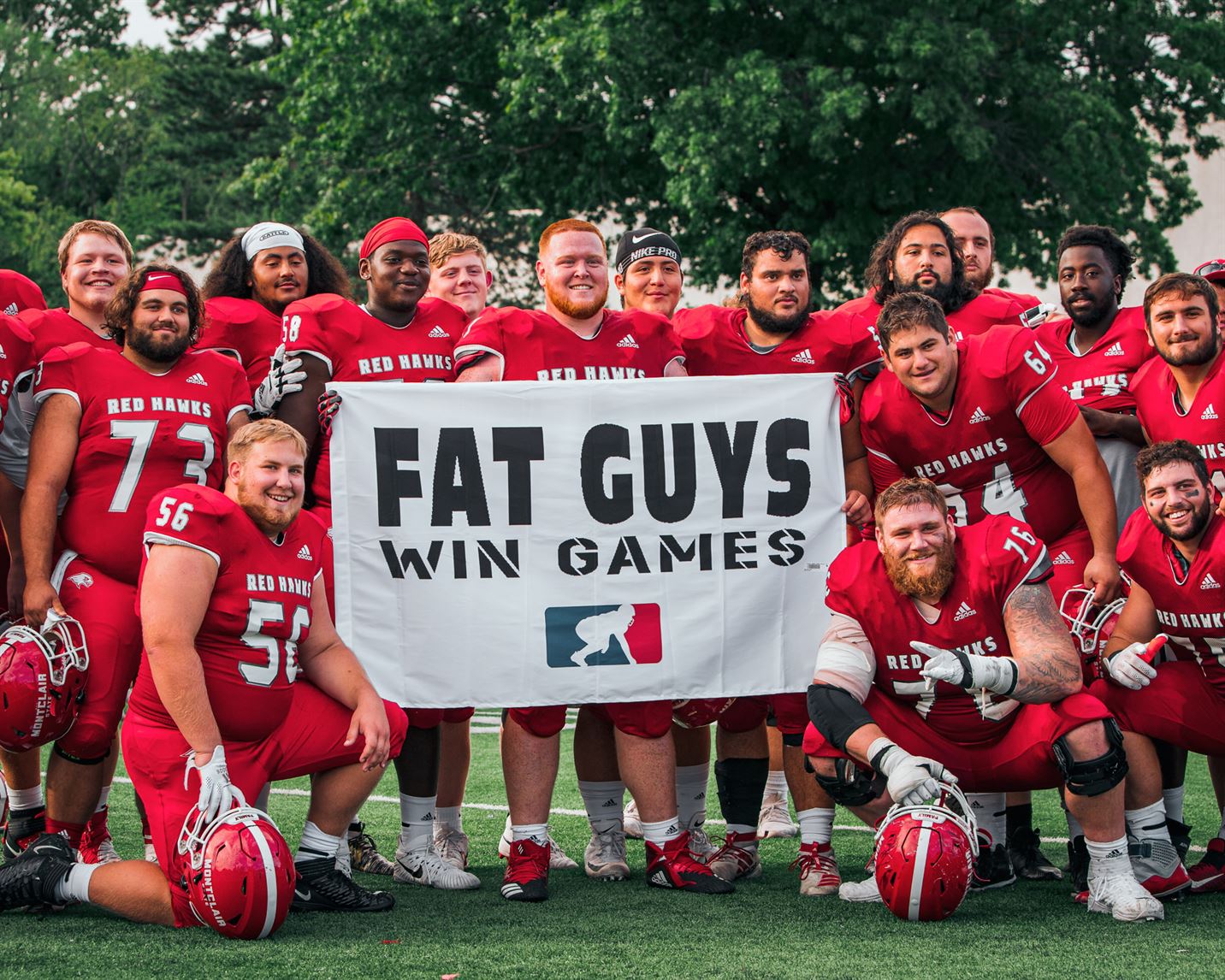 The offensive line celebrates after their 31-10 victory over WPI. The offensive line helped the Red Hawks accumulate nearly 400 yards of offense for the game. Kevin Murrugarra | The Montclarion